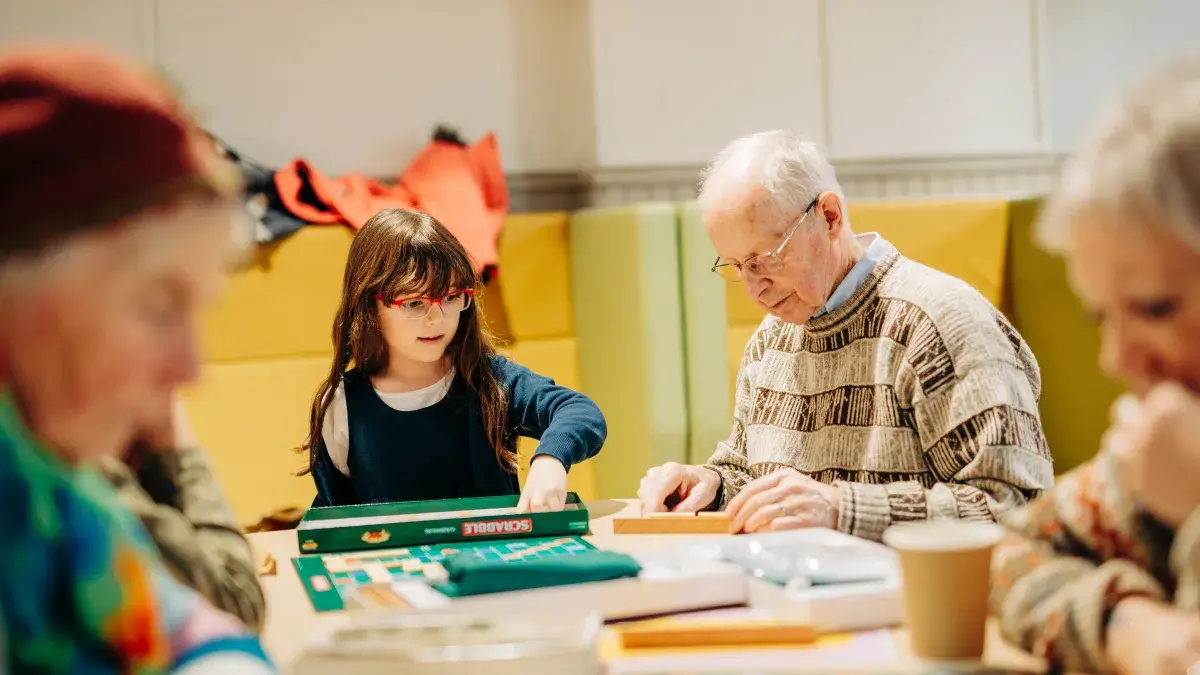 Members of the community playing Gaelic Scrabble. 