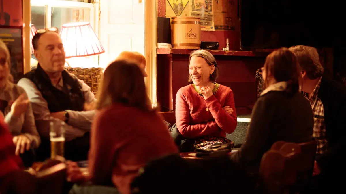 Attendees talking at Guid Crack Storytelling Night.