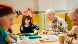 Members of the community playing Gaelic Scrabble. 