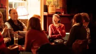 Attendees talking at Guid Crack Storytelling Night.