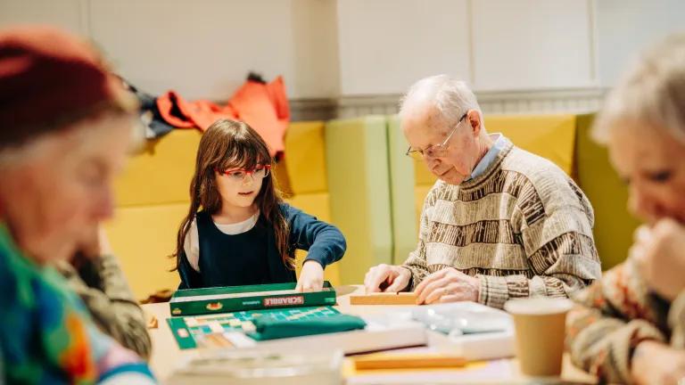 Members of the community playing Gaelic Scrabble. 