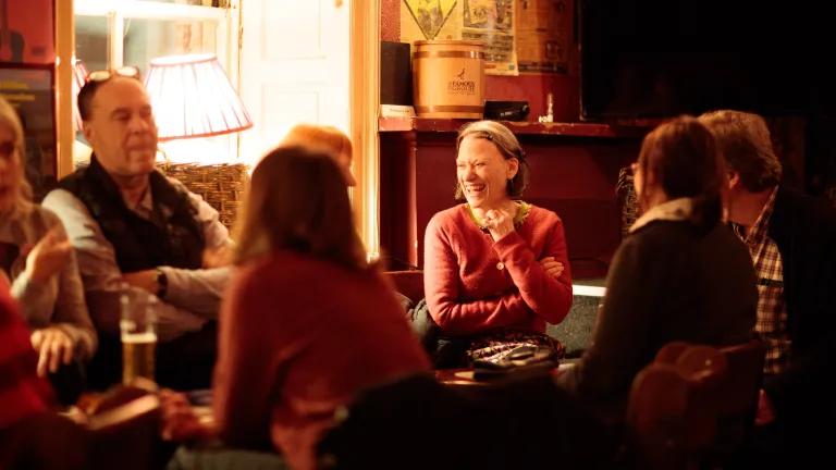 Attendees talking at Guid Crack Storytelling Night.