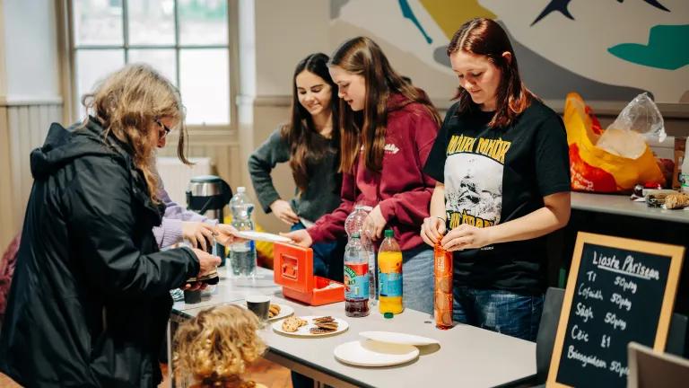 Students serving customers at cafe for the Pop Up Gaelic Centre. 