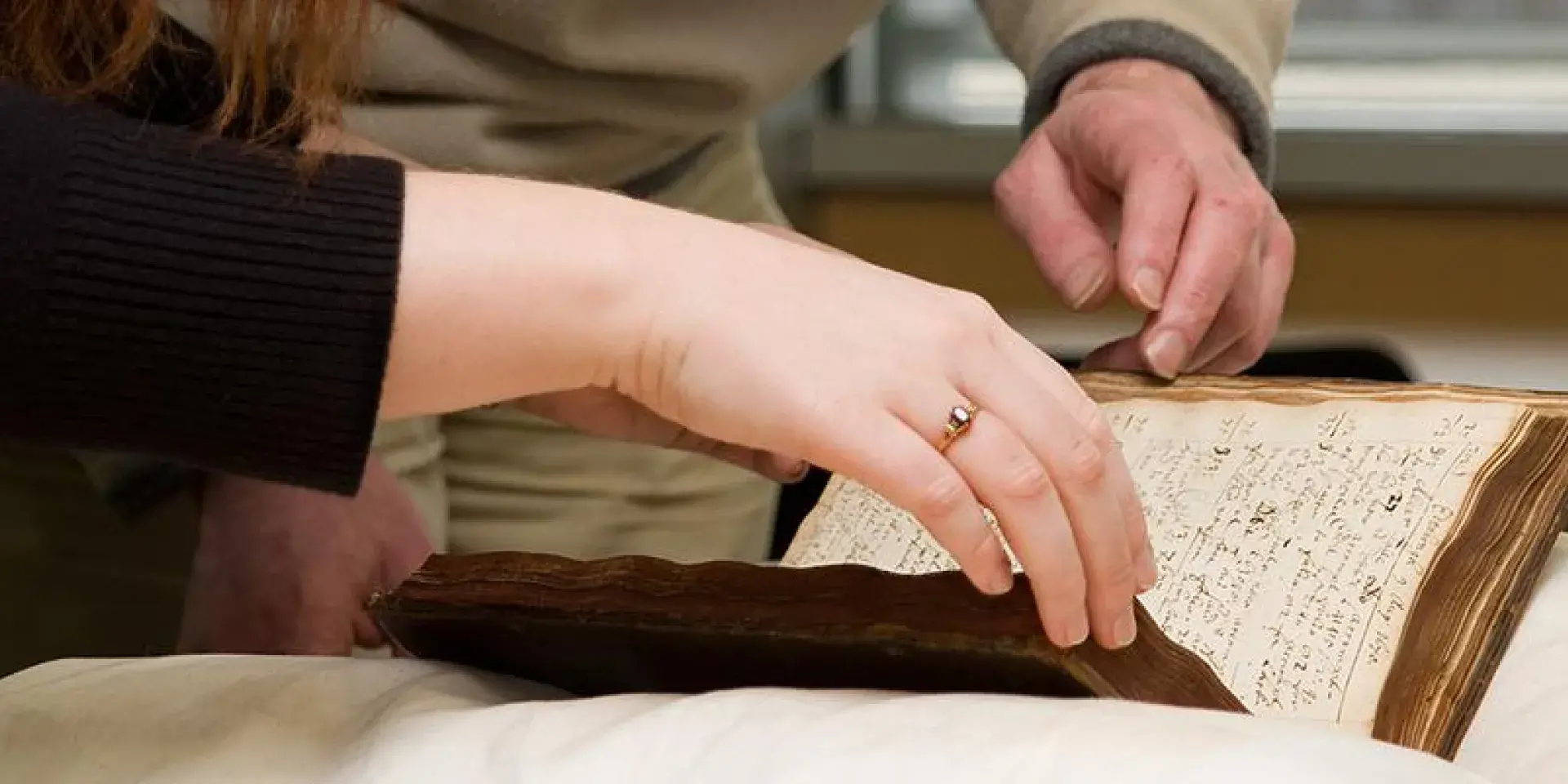 person reading a book in special collections