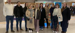 Students posing for photo in the Scottish Parliament.