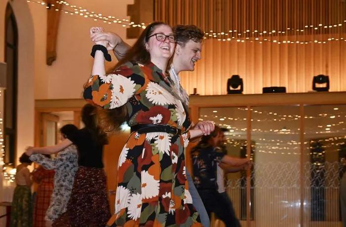 Two people ceilidh dancing