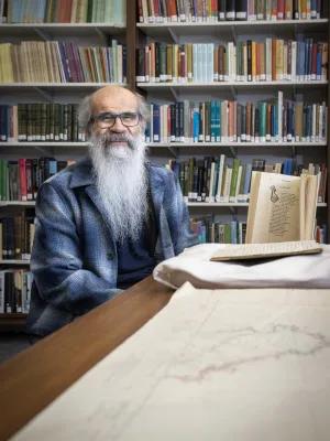 Man sitting in School of Scottish Studies library.