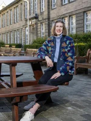 Staff member in the Moray House courtyard.