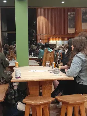 Students watch musicians in Scottish Storytelling Centre. 
